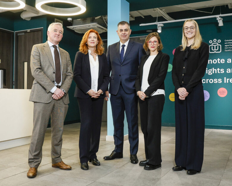 IHREC Chief Commissioner standing with 4 representatives from GRETA in IHREC offices